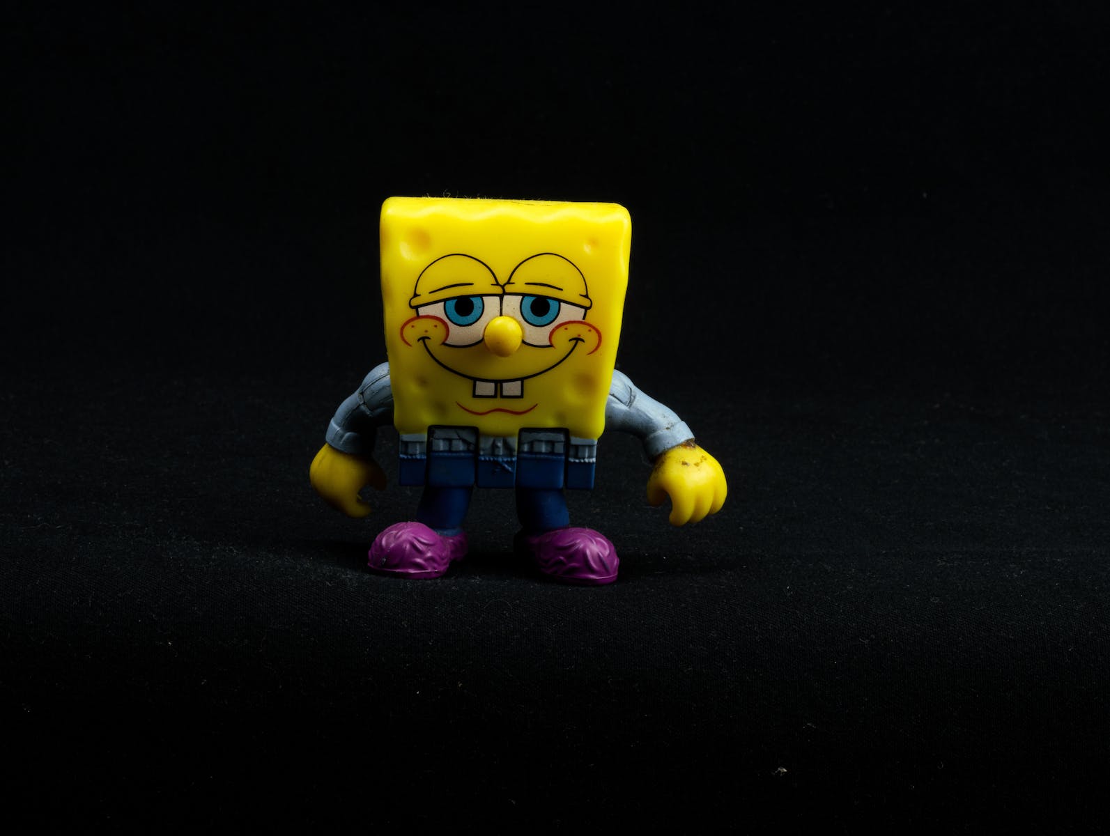 Yellow Toy on Black Background